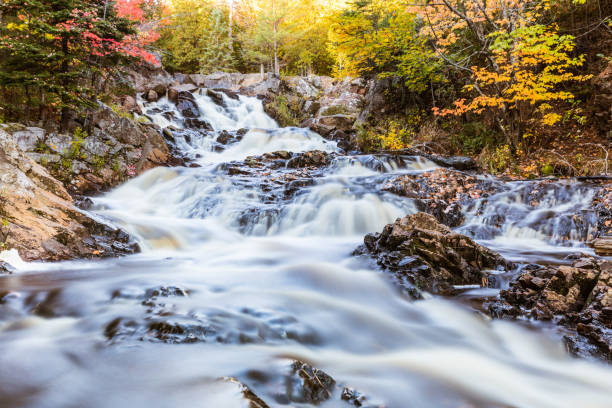 istock Waterfall on a creek through the wood in Canada, long exposure 871196442