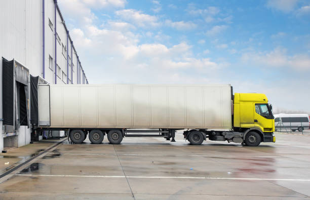 istock Cargo truck at warehouse building 871196720