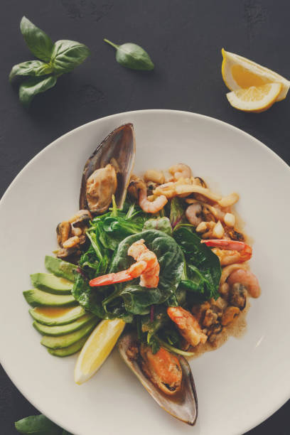 istock Warm salad with grilled seafood flat lay 871199026