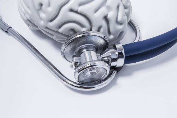 istock Stethoscope or phonendoscope examine the brain, lying on a white medical table view from above. Idea for the neurological or neuroscience medical examination or research 871200520