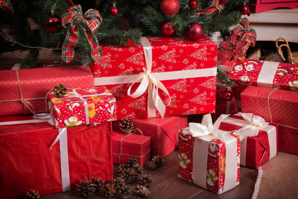 istock Many boxes with Christmas presents under the Christmas tree 871200528