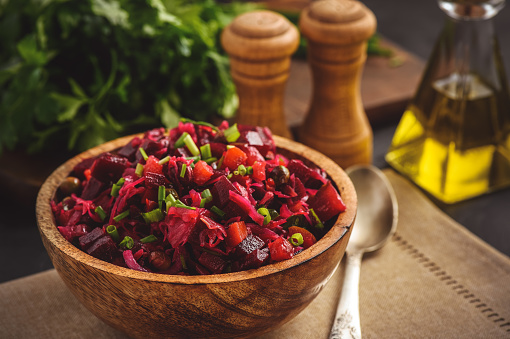 Vegetable salad with beetroot, carrot, pea and onion. Russian style cuisine.