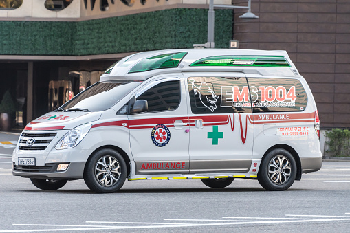 Ambulance in Seoul, South Korea on the road in the daytime.