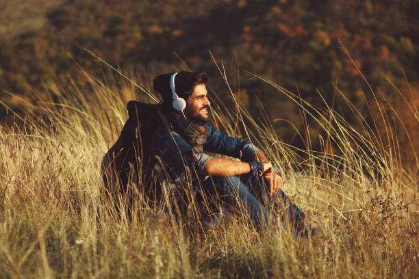 istock Young hiker enjoys a sunny day on the mountain 871208764