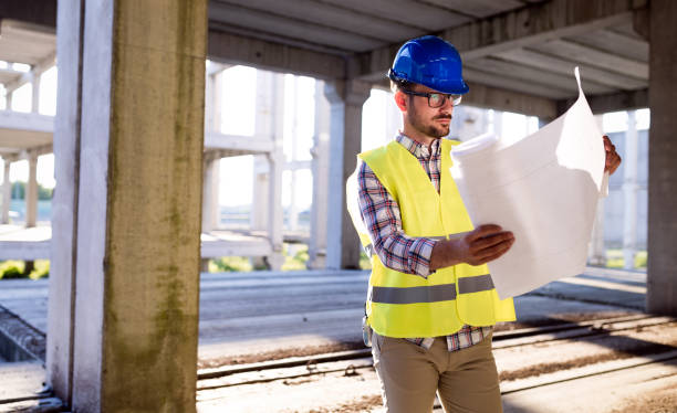 istock Picture of construction site engineer looking at plan 871209146