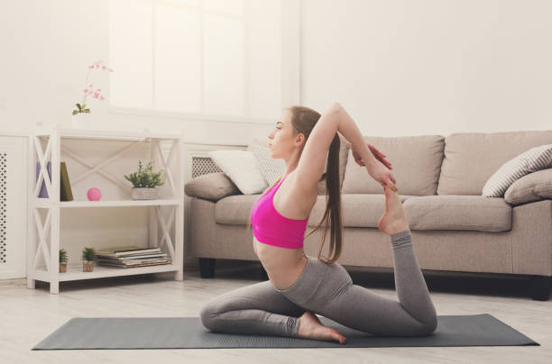 istock Woman training yoga in camel pose. 871211542
