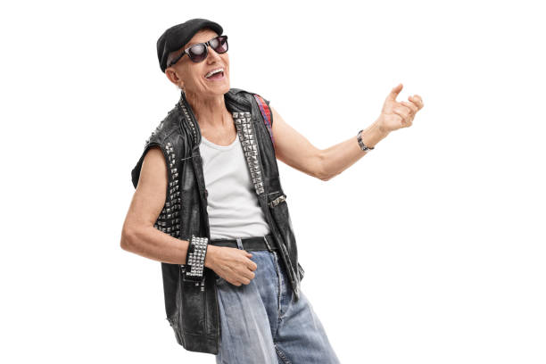 istock Old punk rocker playing air guitar 871212202
