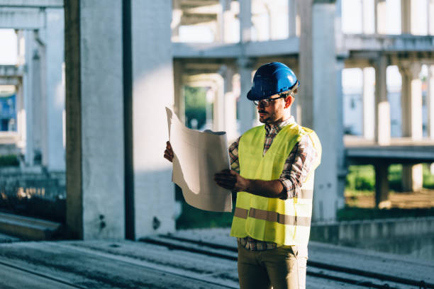 istock Picture of construction site engineer looking at plan 871212558