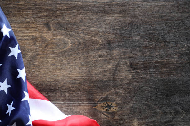 istock American flag on a wooden texture table 871212598