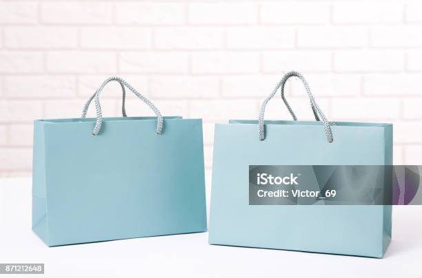 Paper Shopping Bags On White Table Close Up Mock Up Template For Design And Text Stock Photo - Download Image Now