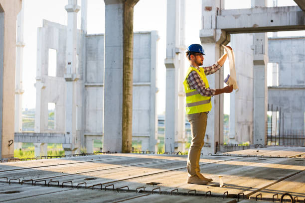 istock Picture of construction site engineer looking at plan 871212784