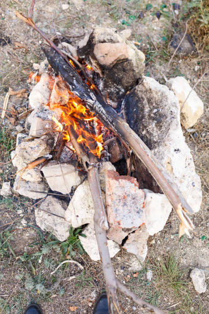 istock A burning bonfire surrounded with stones. Fire place, outfoor. View from top. 871213522