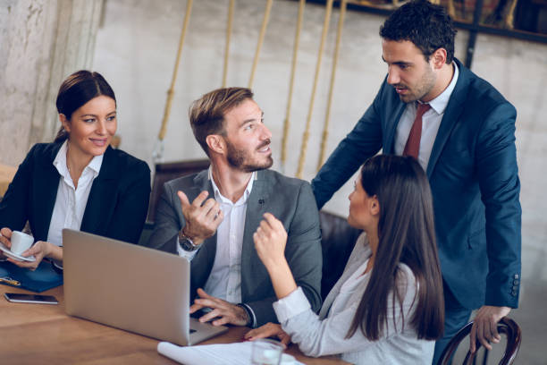 istock Business people cooperating over new business project using laptop 871216600
