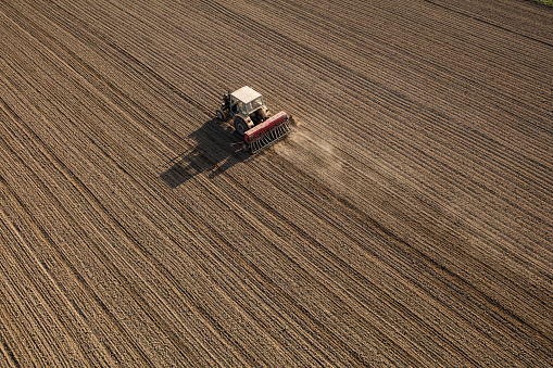 aerial view of the tractor on the harvest field in Poland
