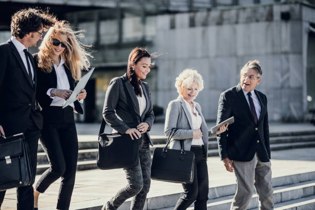 istock Business People Walking and Discussing 871217796