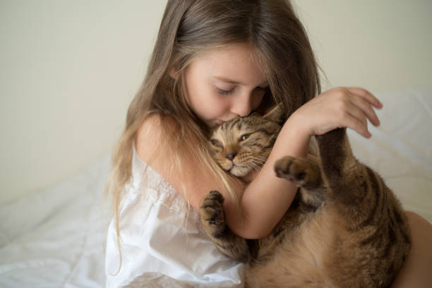 istock Little girl with cat 871223816