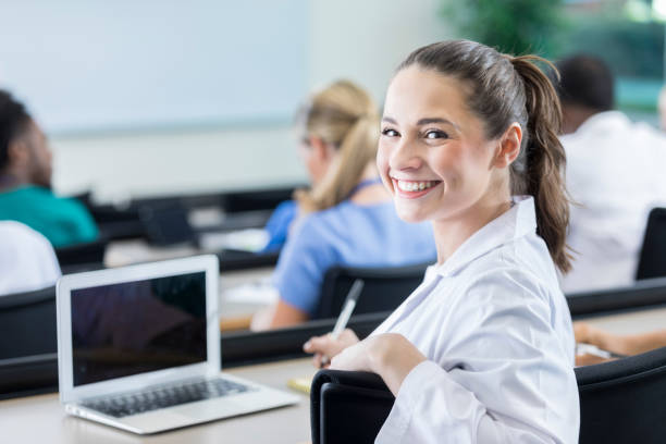 istock Cheerful young female medical student attending class 871227246