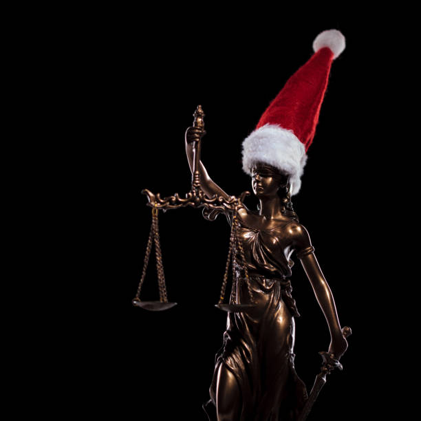 goddess of justice wearing santa claus hat, side view side view of goddess of justice wearing santa claus hat on black background red blindfold stock pictures, royalty-free photos & images