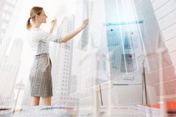 istock Professional female engineer working on the blueprint 871228056