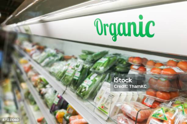 Organic Food Signage On Modern Supermarket Fresh Produce Vegetable Aisle Stock Photo - Download Image Now
