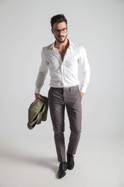 istock smart casual man with coat in his hand 871231962