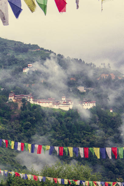 View of Trongsa Dzong and Ta-Dzong with foggy hills, Bumthang, Bhutan, Asia. stock photo