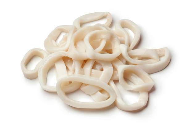 Fresh raw squid rings Heap of fresh raw squid rings on white background calamari stock pictures, royalty-free photos & images