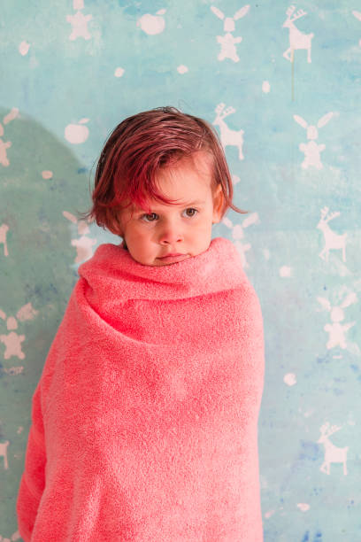 istock The child is wrapped in a towel. 871234700