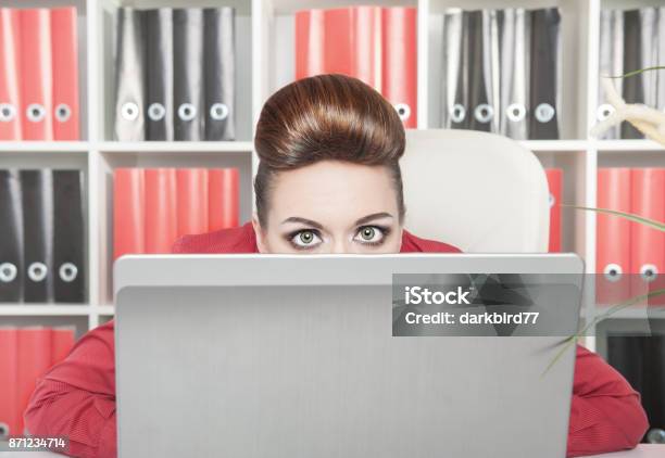 Business Woman Afraid And Hiding Behind The Computer Stock Photo - Download Image Now