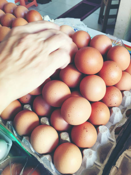 istock fresh eggs in the paper package at the market. 871239196