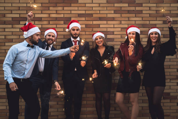 istock Group of friends celebrating Christmas 871247670