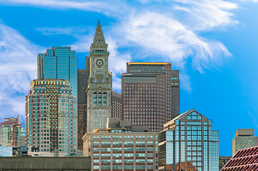 view to skyline of Boston with clock tower and modern skyscraper