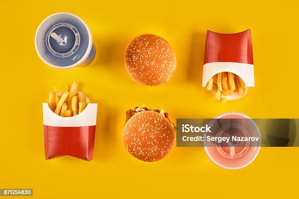 Fast Food And Unhealthy Eating Concept Close Up Of Fast Food Snacks And Cold Drink On Yellow Background Stock Photo - Download Image Now