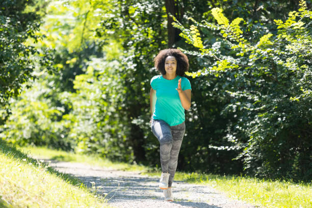 istock African woman jogging in park 871255008