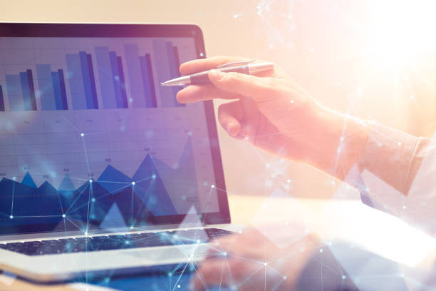 istock Businessman working on global financial trading growth analysis strategy using laptop.Modern business innovation investment concept.Office project with virtual forex graph and chart data interface 871259652