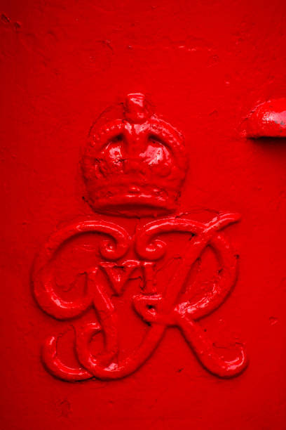 Red post box Famous red post box in Cambridge, UK. It's a physical box into which members of the public can deposit outgoing mail intended for collection by the agents of a country's postal service. george vi stock pictures, royalty-free photos & images