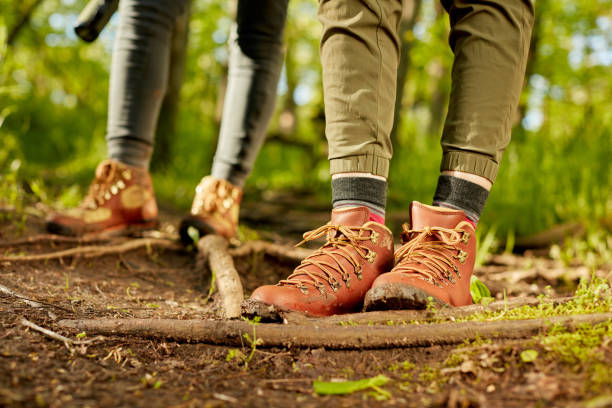 Leather hiking boots of a female hiker stock photo