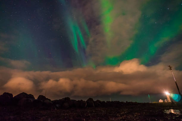 istock Northern lights Aurora Borealis above landscape in Iceland with 871269802