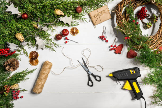 istock How to make christmas door wreath. The working process. The decorator's workplace. Top view 871272552