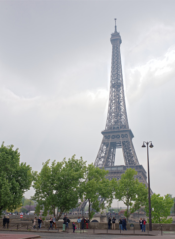 Paris; France-May 05; 2017: View of the Eiffel Tower from  De Varsovie square.On the square walk and take pictures of tourists