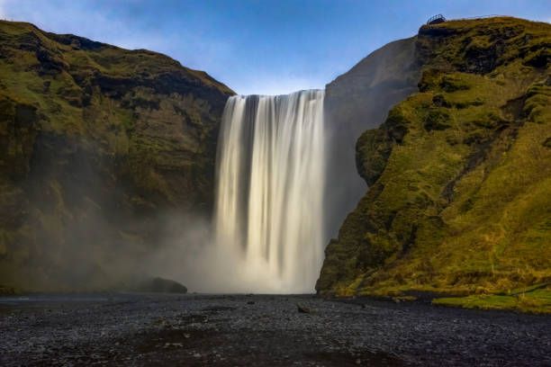 istock Seljalandsfoss waterfall in Iceland with mountains and blue sky 871273710
