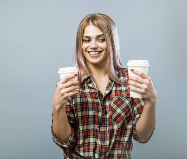 istock Handsome girl with coffee cups 871275300