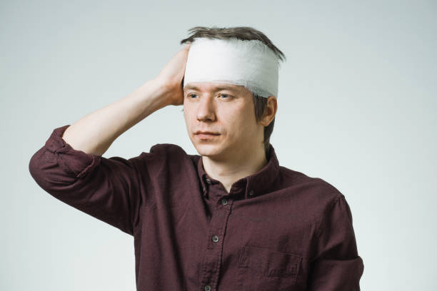 istock Man with bandage on his head 871279124
