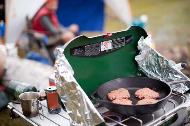 istock Ground beef patties cooking on a gas burner 871280266