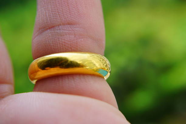 istock Gold Wedding Rings Forming A Heart Shape 871284522