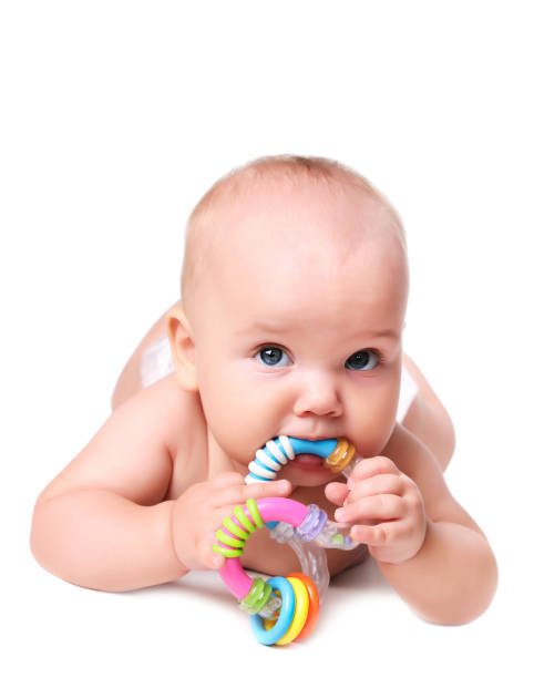 istock Caucasian baby portrait with toy isolated. 871284838