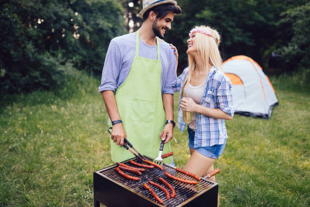 istock Beautiful woman and handsome man having barbecue 871285096
