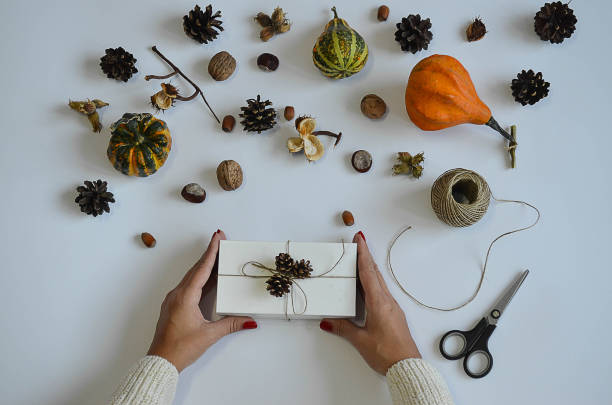istock Woman holding gift, laid out against a background 871292692