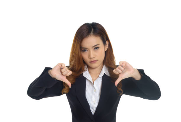 istock businesswoman with thumb down on white background 871294098