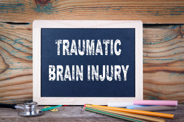 istock traumatic brain injury. Chalkboard on a wooden background 871296760